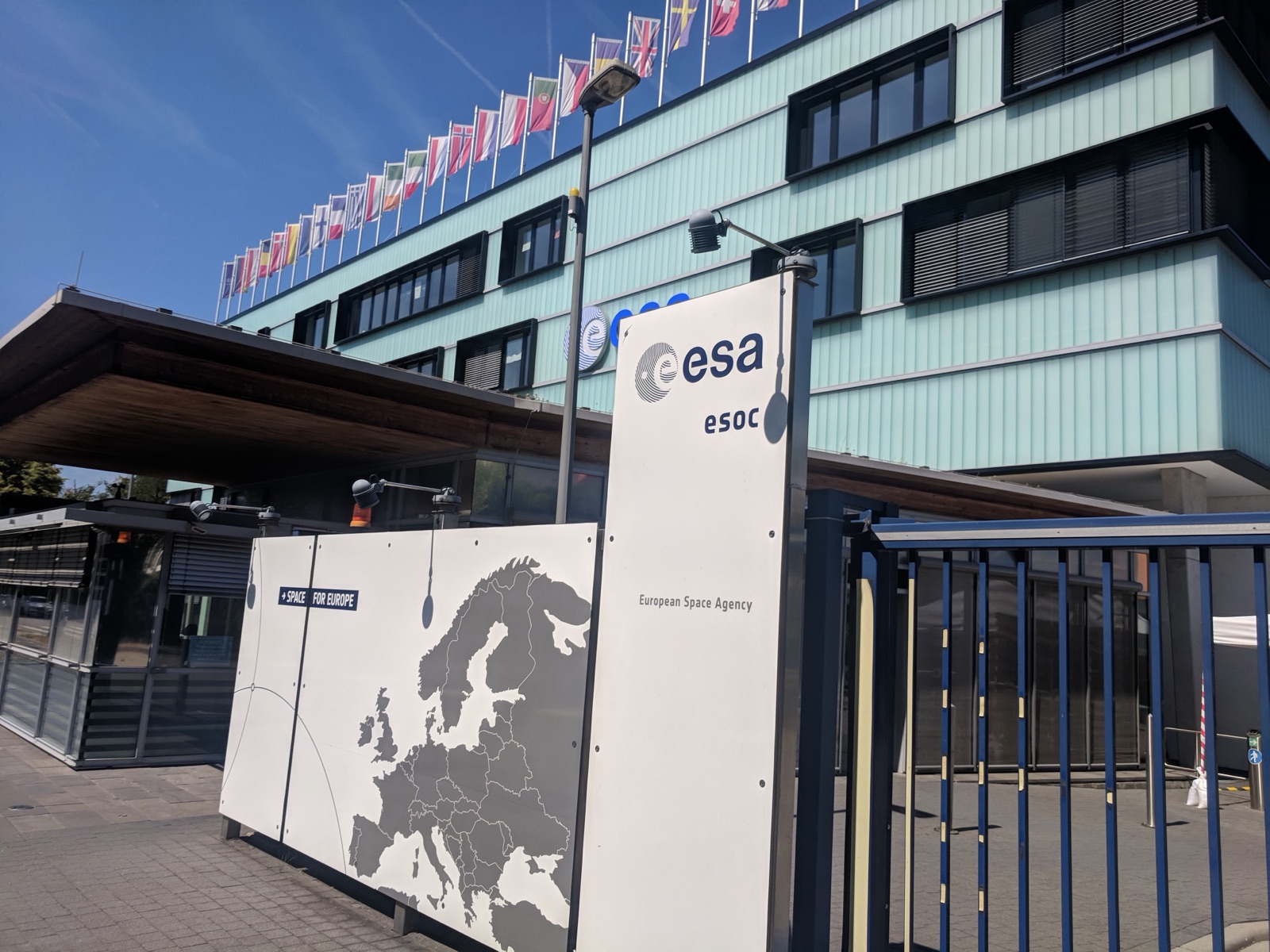 The “Space for Europe” sign at the entrance of ESA’s ESOC centre, with member-state flags above